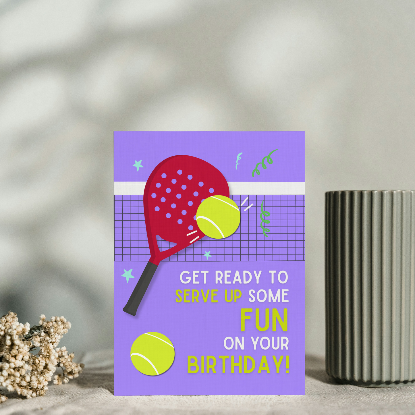 Birthday card with tennis racket and ball design on a purple background